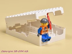 Fehér Lego kompatibilis doboz Raspberry Pi-hez nyitott tetővel és Lego figurával